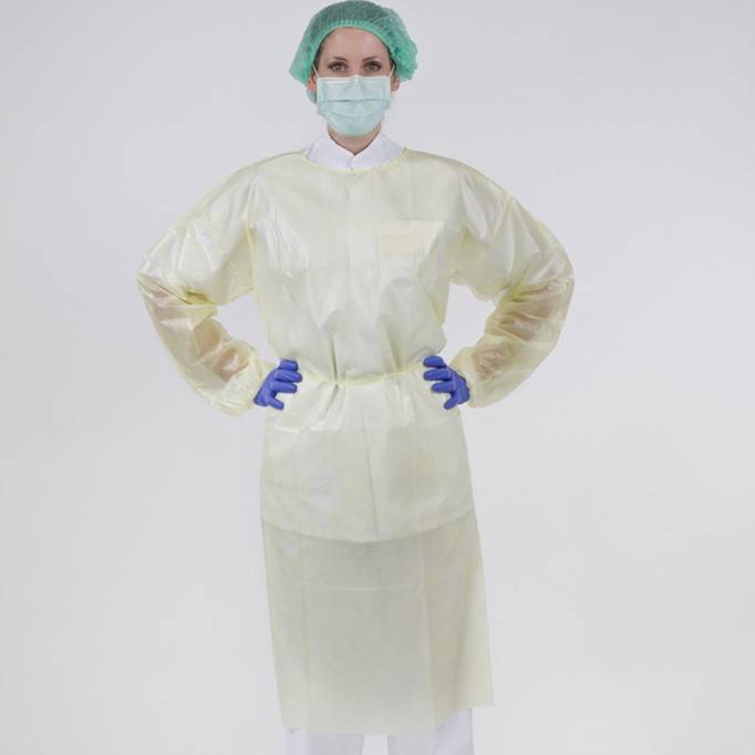 Person wearing yellow impervious isolation gown